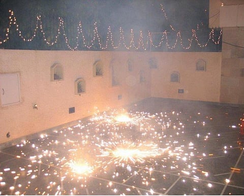 It is glamorous for many to burst crackers in Diwali. Credit: Wikimedia Commons