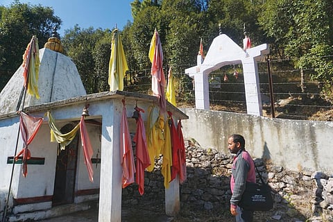 Devotees undertake the journey to the goddess' temple on the peak after offering prayers to the three guardian angels