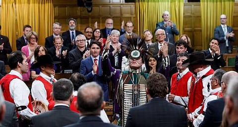 A member of the Tsilhqot’in Nation performs a traditional ceremony on the floor of the Canadian House of Commons as Prime Minister Justin Trudeau and other lawmakers look on    Credit:Justin Trudeau/Twitter