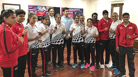 Minister for Sports, Rajyavardhan Rathore with some of the sportspersons who were part of the Asian Games contingent   Credit: Press Information Bureau