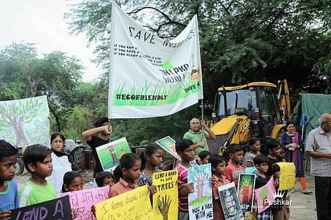 Residents and activists protest at the city forest in Noida.