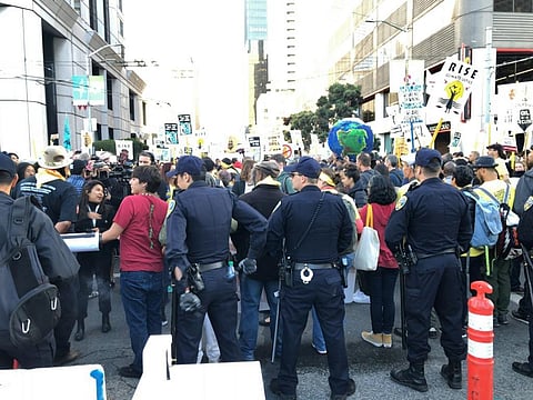 Environmental activists and police face off on the opening day of the GCAS. Credit: Joydeep Gupta