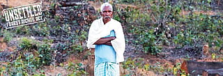 70-year-old Adil Sai Armo looks at the forest land in Ghabarwa village in Chhattisgarh's Sarguja district that once belonged to people like him, but was taken away for mining (Photo: Vikash Choudhary)