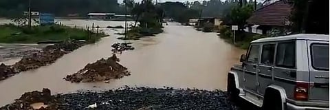 Vehicular movement is disrupted at Malabar Road in Kodagu's Virajpet due to flooding. Kodagu has received double the amount of August's rain in the last nine days. Photo: Darshan Devaiah B P/@DarshanDevaiahB/Twitter
