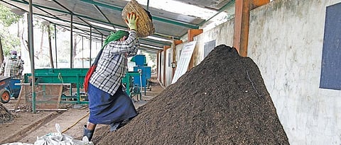Piling co-compost at the Ketti resource management centre in the Nilgiris district. Photograph: Vikas Choudhary