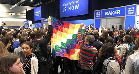 A mass of loud, persistent young protesters chanting, “no more loopholes,” “no carbon markets,” “climate justice now” at CoP 25. Photo: @jcatanoso