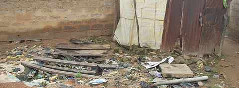 Filled-up drop hole toilets in Passo village, Nigeria. Photo: Newsan
