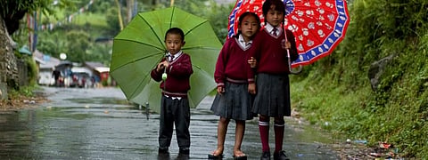 Children in Sikkim on a rainy day. Photo: Wikimedia Commons