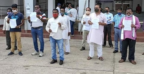 Activists holding copies of memoranda that they submitted to the Jharsuguda collector October 12 on holding a fresh public hearing about Vedanta’s smelter expansion. Photo: Amjad Badshah