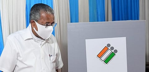 Pinarayi Vijayan casting his vote. Photo: @CMOKerala
