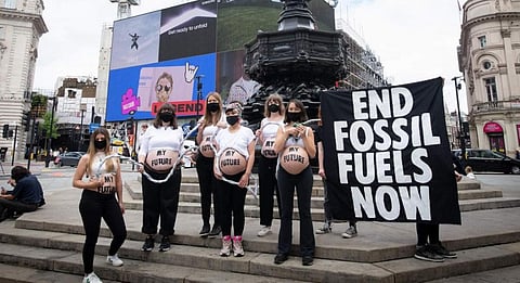 Six pregnant women bare their baby bumps in London on August 1, 2021, demanding an end to fossil fuels and a future for their unborn children. Photo: Gareth Morris for Extinction Rebellion @XRphotos / Twitter
