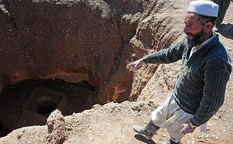 An Afghan worker shows a collapsed Karez in Herat province in 2010. US-led coalition troops and the Afghan government had worked to rebuild it and provide water and work to locals. Photo: Wikimedia