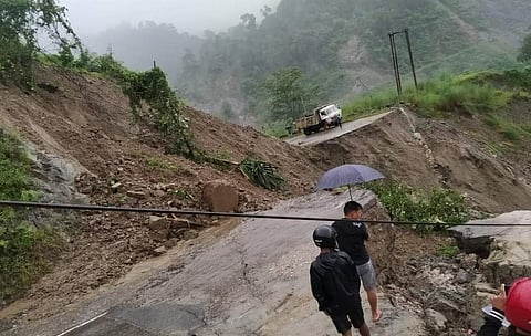 A broken section of Aalo Pasighat road in East Siang district caused by a heavy landslide on August 13