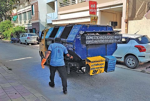 Garbage collection trucks in Indore have six compartments to carry  wet, dry, hazardous, plastic, sanitary and e-waste (Photograph: Richa Singh)