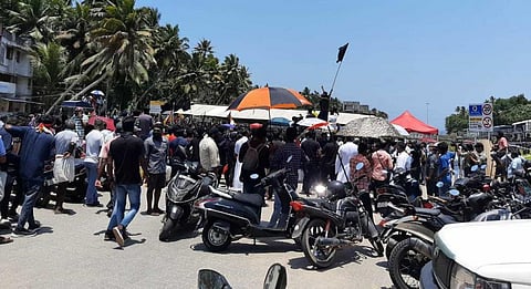 Fish workers barge into the construction site of the Adani International Seaport at Vizhinjam in Thiruvananthapuram August 16, 2022 and wave black flags. Photo: South First