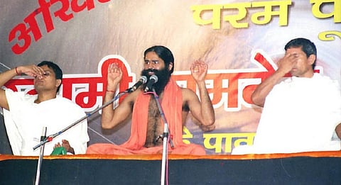 Baba Ramdev (centre) allegedly carried out smear campaigns against allopathic medicines, their doctors and Covid-19 vaccination. Photo: Wikimedia Commons 