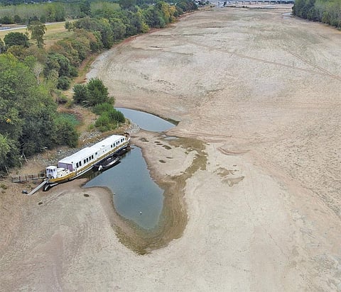 FRANCE : A dry branch of the Loire River in Loireauxence, France, on August 16. The country receives 10 to 14 days of rainfall in July, but 2022 saw a record deficit rain of fewer than four days, making it France’s driest July in 60 years. In August, the country announced the drought its most severe in recorded history. French agricultural  federations have said the sector will need 
€2-4 billion (US $1.9-3.8 billion) to recover the losses in production. The situation is similar in most of southern Europe. England is witnessing its driest July since 1935, while Italy is going through its driest year since 1800. Heatwaves have become more frequent, longer and severe in Europe than almost anywhere else on the planet due to global warming and changes in jet streams as well as ocean circulations. (Photograph: Reuters)