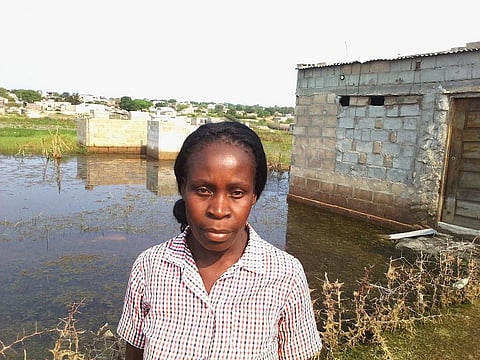 Odete Carlos in front of her rented house. Photo: Charles Mangwiro