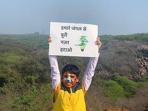 “Keep your 'evil eye' away from our forests”. Photo: Aravalli Bachao Citizens Movement