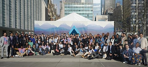 Young water advocates and experts from around the world pose for a group picture in front of the Water Tunnel at UN HQ. Photo: @UNYouthEnvoy / Twitter