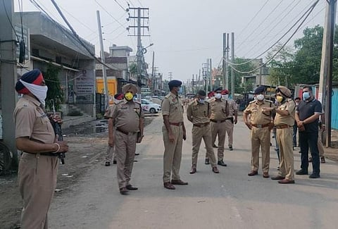 Police stand guard in Giaspura, Ludhiana after the gas leakage on April 30. Photo: @PunjabGovtIndia / Twitter
