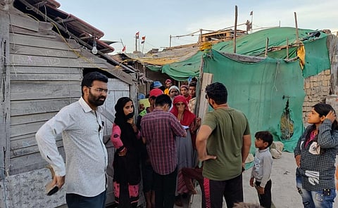 People being evacuated from the fishing colony at Rupen Bandar in Dwarka. Photo: Himanshu Bhayani