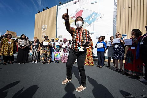 Babitha leads protest on climate justice and gender rights in front of COP27 venue. Photo: Marisa Hutchinson / International Women's Rights Action Watch.