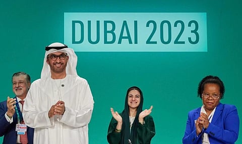 COP28 President Sultan Al Jaber smiles as the Loss and Damage Fund is operatilonalised on Day 1 of COP28. Photo: @COP28_UAE / X
