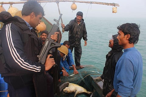 Coast guard officials seize sea turtles from a trawler at Gahiramatha. Photo by special arrangement / Ashis Senapati