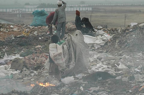 Indian rag pickers sort through garbage and pick out recyclable materials to sell at the Ghazipur landfill in Delhi, India. Photo for representation:  Agnimirh Basu / CSE