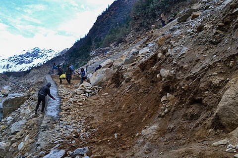 Labourers working on reconstructing the road to Kedarnath in Rudarprayag, Uttarakhand after the disaster.  