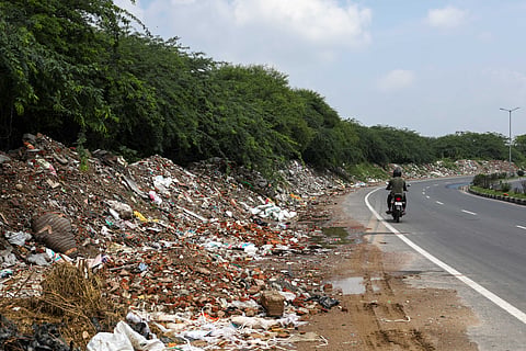 Construction & demolition waste dumped along the Gurugram-Faridabad road in Aravali