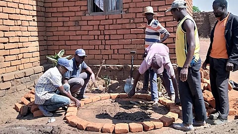 A calabash rainwater harvesting system being constructed.