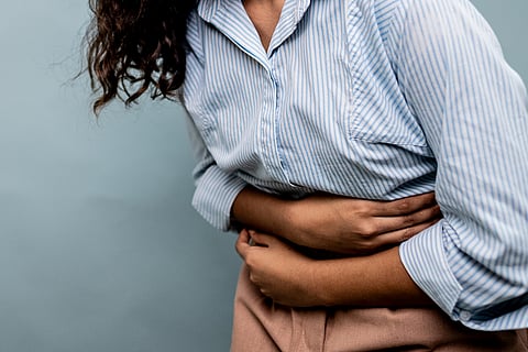 The most common symptom of endometriosis is debilitating pelvic pain before and during menstruation, or during intercourse.