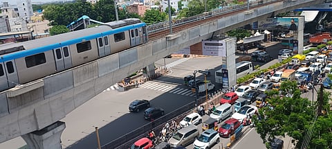 Hyderabad metro train zooms past through the Panjagutta circle, one of the most-busy traffic junctions in Hyderabad city. Metro services are yet to catch up with the needs of the city even as the city continues to add more two and three wheelers onto the roads.