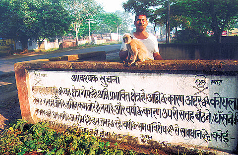 A signboard that reads, “This region is fire-affected”. 