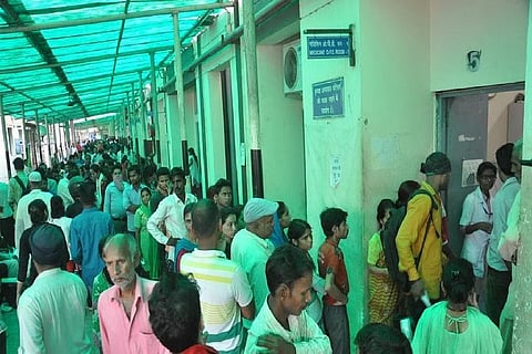 People queue for treatment at the largest government hospital in Dehradun, the capital of Uttarakhand. 