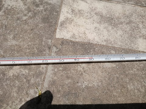 A thermometer placed on a paved surface in Ghaziabad appeared to show a reading of 50°C on May 18. The reading could not be independently verified and may differ from official air temperature measurements recorded under standard weather station conditions.
