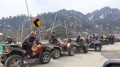 ATV drivers wait for tourists at Solang Nala, Manali.
