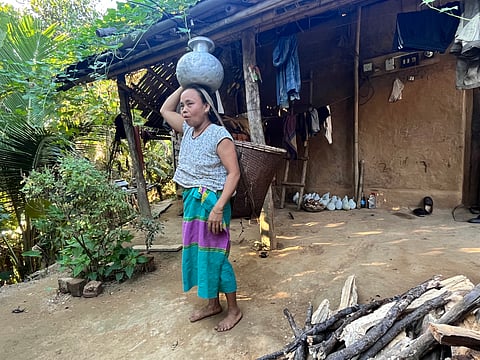 Anita Tripur from Dhalai district in Tripura fetching water. 