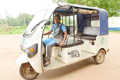 41-year-old Sabita Bhoi drives an electric rickshaw under Odisha’s AMA E-Ride service, ferrying passengers to and from AMA Bus stops in the state capital.