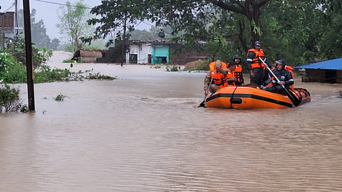 Rescue teams evacuate people from flood-hit areas in Odisha’s Ganjam district.