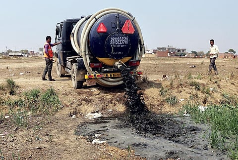 A truck dumps human excreta in an empty field near the
Delhi-Ghaziabad border (Photograph: Vikas Choudhary)