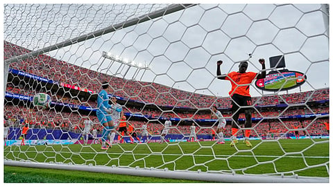 Netherlands' Brian Brobbey (19) celebrates after Tunisia's Ellyes Skhiri (17) scored an own goal during the World Cup Group F soccer match between Tunisia and the Netherlands in Kansas City, Mo.