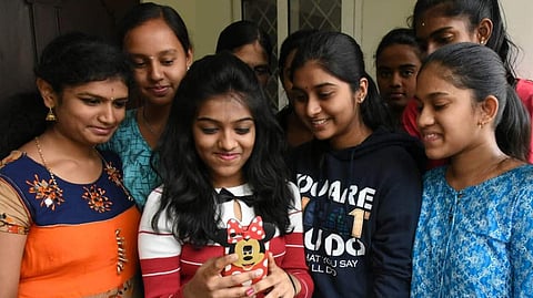 Students checking their results image for representation only 