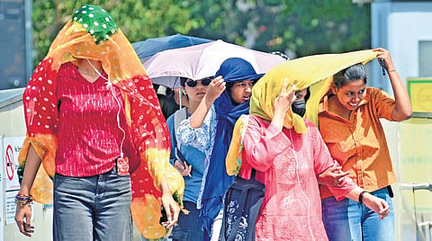Women braving heat in Delhi as the temperature touches 42 degrees Celsius. 