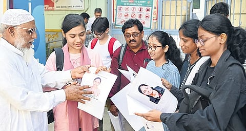 Candidates and their parents outside the examination centre in Basavanagudi, Bengaluru, on Sunday.