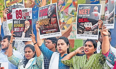 Karnataka Youth Congress members protest the cancellation of NEET UG 2026, in Bengaluru on Tuesday