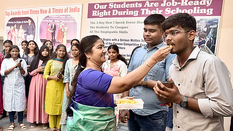 Students and teachers celebrate after the Class 10 results are announced at Everwin Matriculation Higher Secondary School in Chennai on Wednesday.