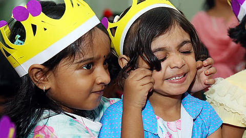 Students arrive with excitement and anticipation on the first day of the new academic year at South Government LP School in Kochi on Monday. 